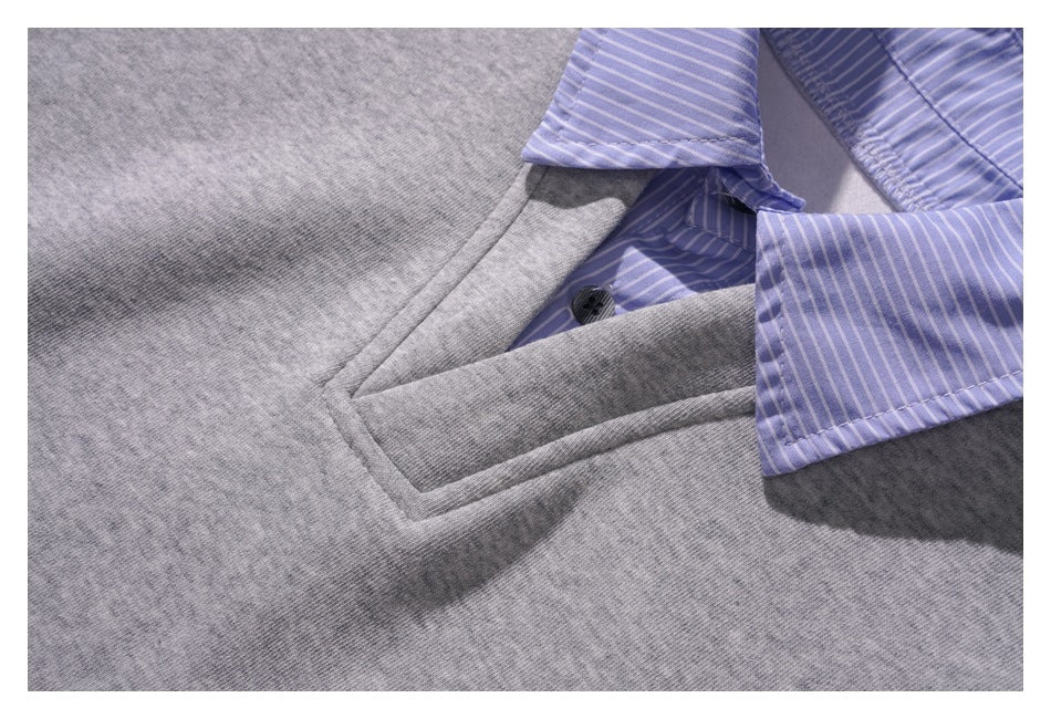 Close-up of the gray top's front placket, dark button, and lavender striped collar.