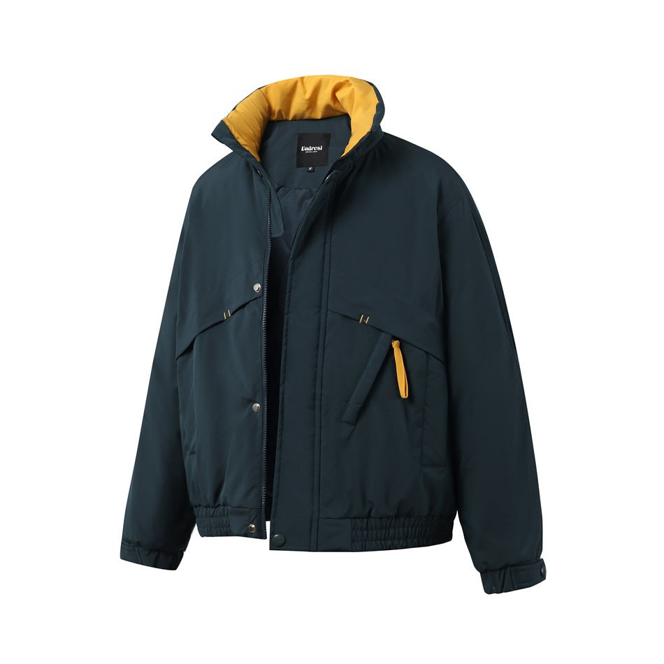 Dark green padded jacket with zip partly open, showing yellow collar lining, snap placket and yellow pull tab