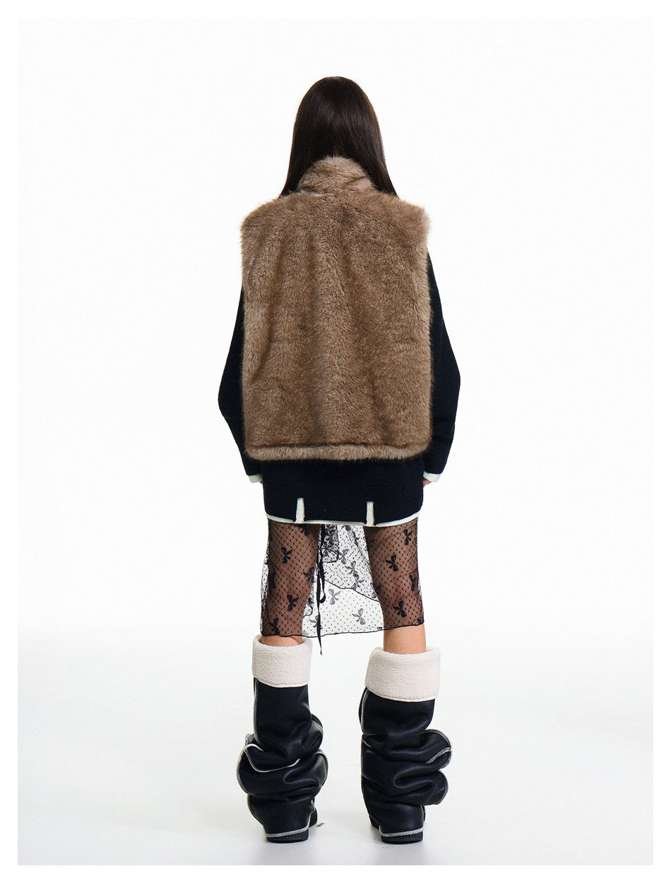 Rear view of a model wearing a brown fur-textured vest over a dark sweater.