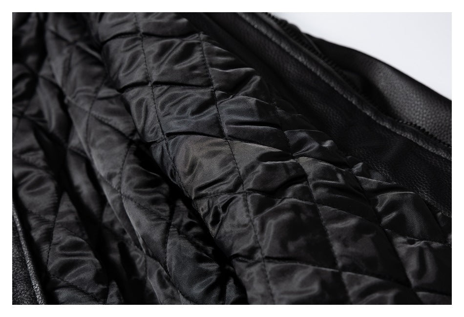 Close-up of the black jacket's shiny quilted lining and pebbled outer edge.