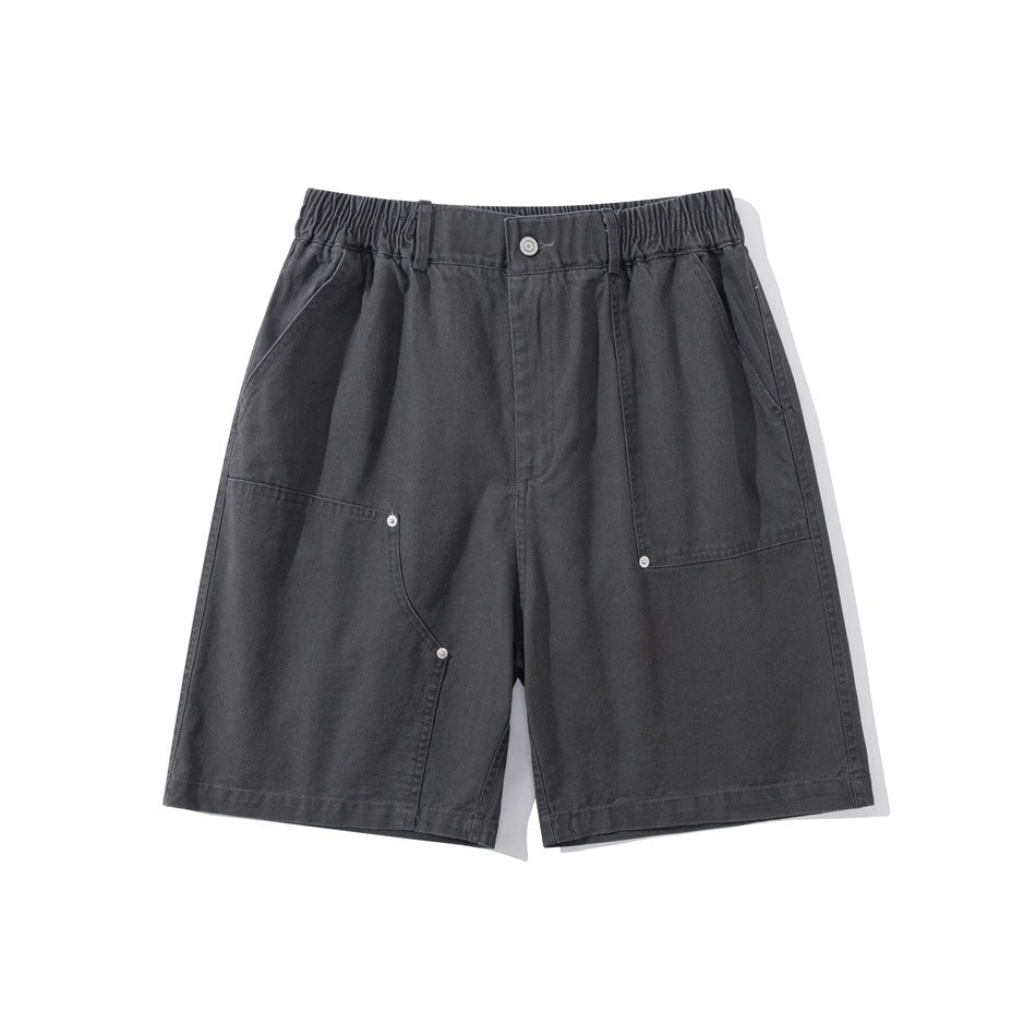 Dark gray knee-length shorts flat lay, front view with elastic waist, button, patch pockets and metal rivets