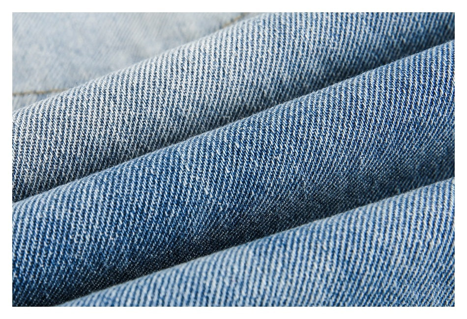 Macro view of the blue-and-white twill weave and faded shades of denim.