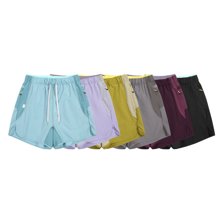 Six pairs of drawstring shorts displayed together in light blue, lavender, yellow, gray, burgundy, and black.