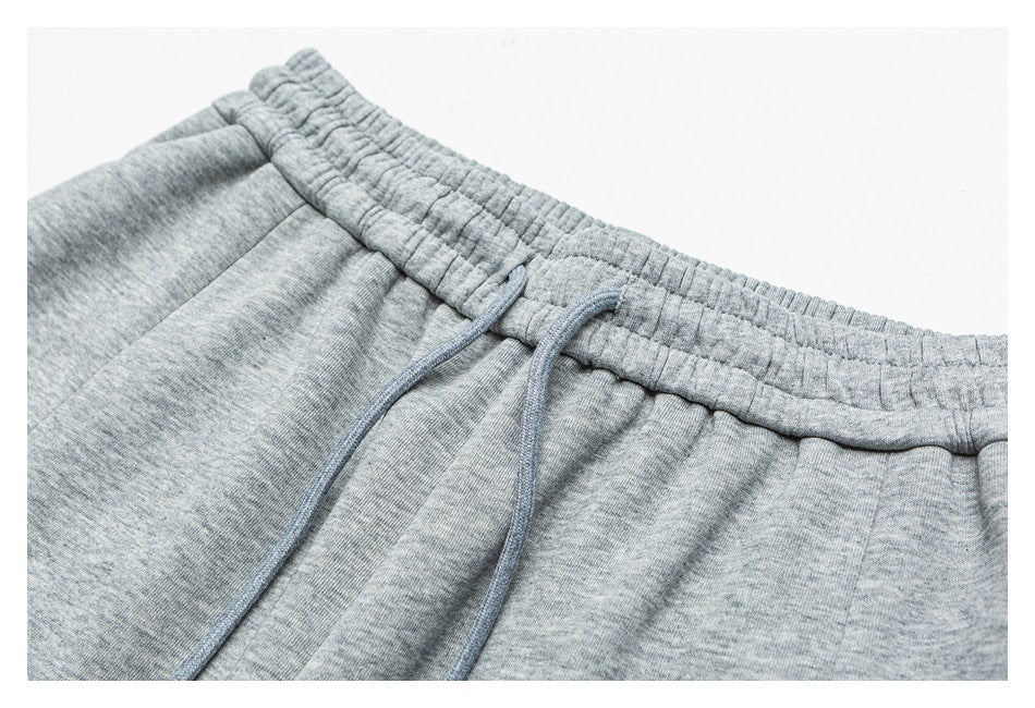 Close-up of the heather gray pants’ elastic waistband and matching drawcords.