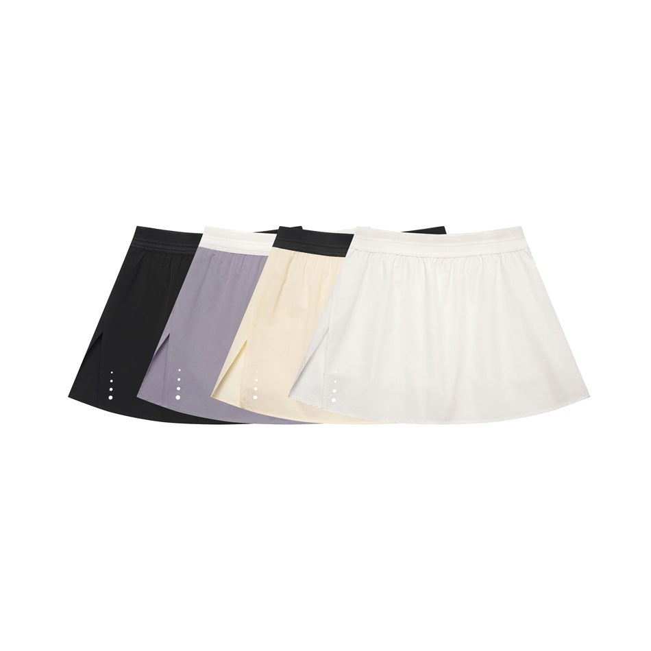 Four flared skirts arranged together in black, lavender, pale yellow, and white, with contrasting waistbands.