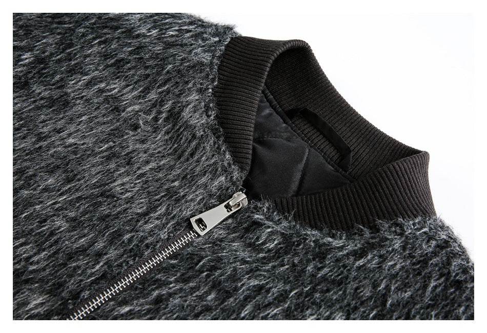 Close-up of the charcoal gray fuzzy jacket's black ribbed collar, lining, and silver front zipper.