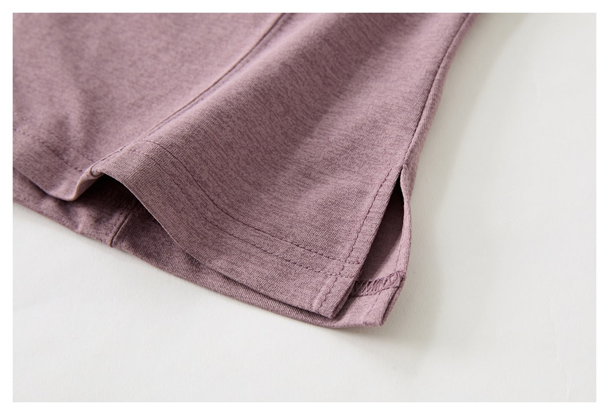 Close-up of the mauve top's lower hem and side slit.