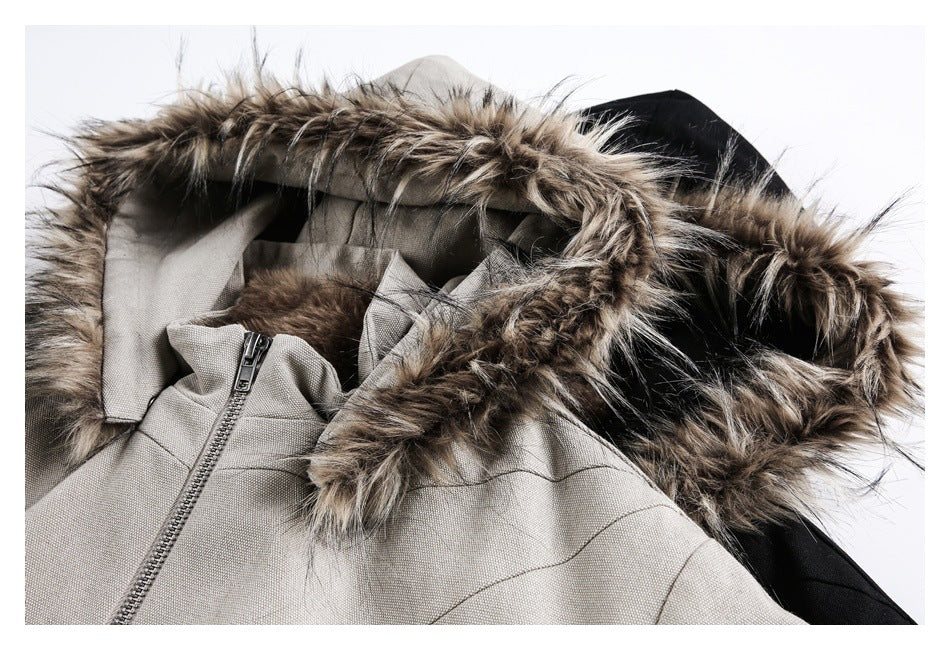 Close-up of the taupe jacket's hood with a long brown-and-tan faux-fur trim and front zipper.