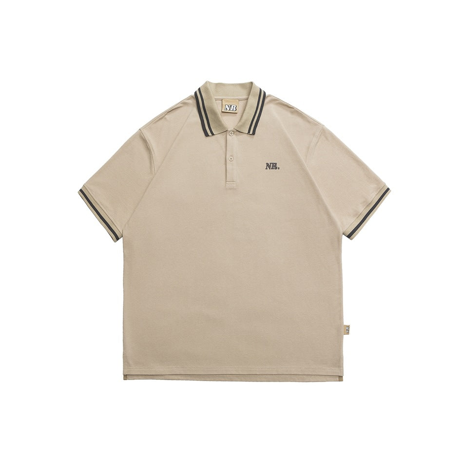 Khaki short-sleeve polo shirt with dark gray striped collar and cuffs and a small NR. chest mark, front view