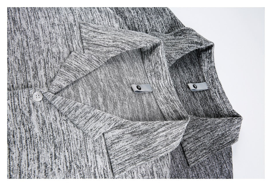 Close-up of the shirt's collar and inner neckline labels in dark and light gray colorways.
