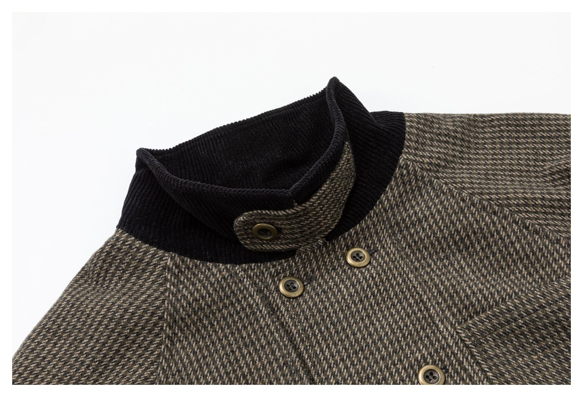 Close-up of the jacket's black ribbed stand collar, buttoned tab, and houndstooth fabric.