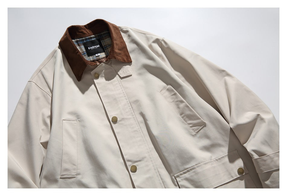 Front view of a light beige jacket with a brown collar, brass-tone buttons and large flap pockets.