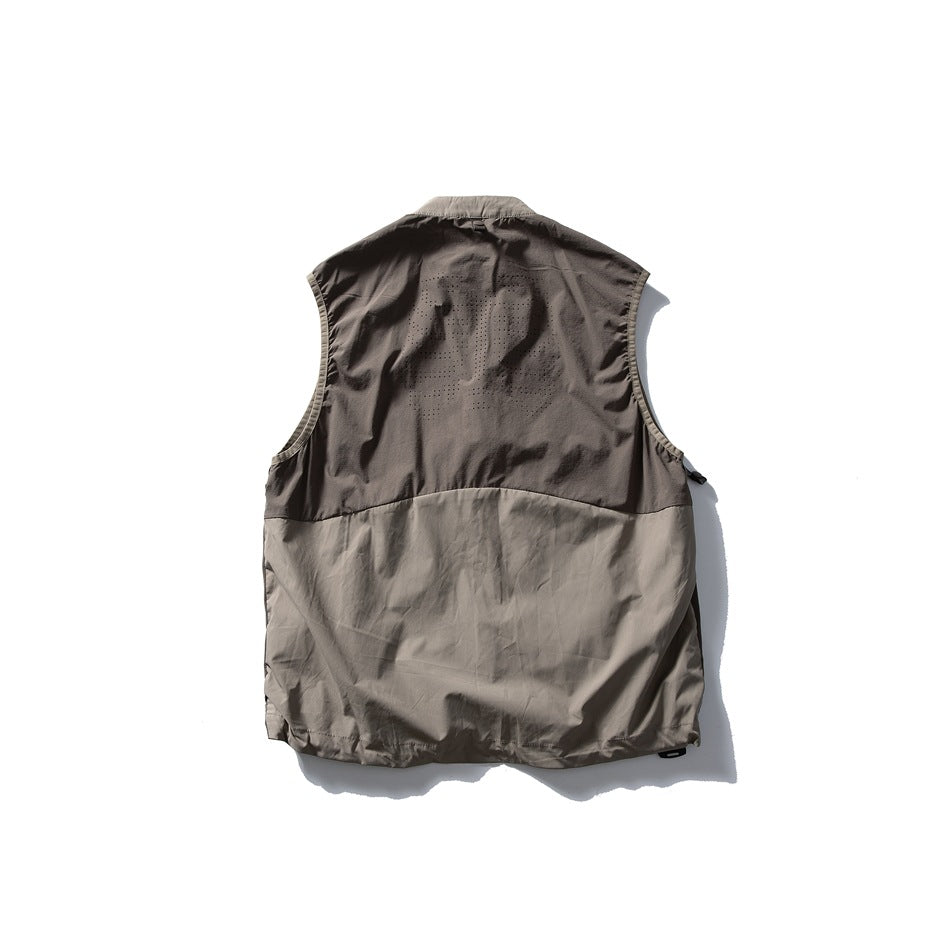 Back view of a taupe-gray sleeveless vest with a darker upper panel and perforated detailing.