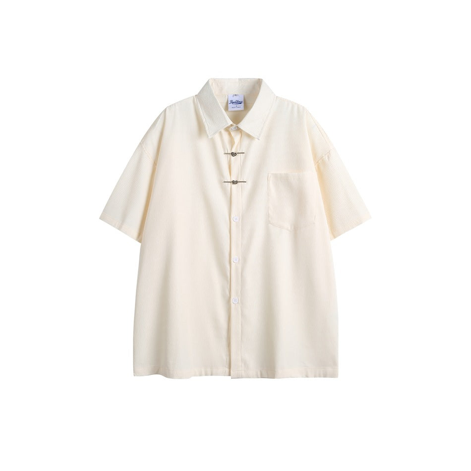 Apricot short-sleeve button-front shirt with chest pocket and two metal heart clasps, flat front view