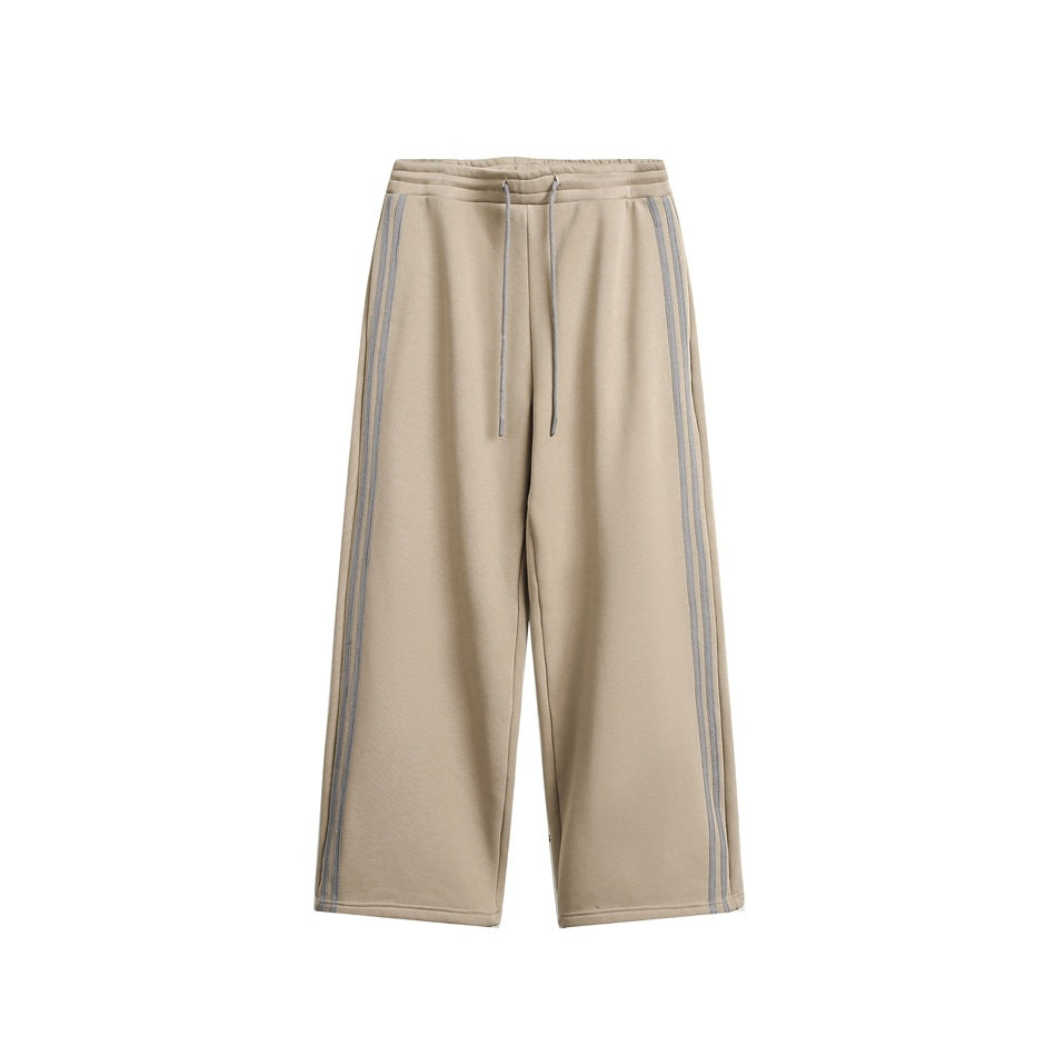 Khaki wide-leg sweatpants with drawstring waist and gray double side stripes, flat front view