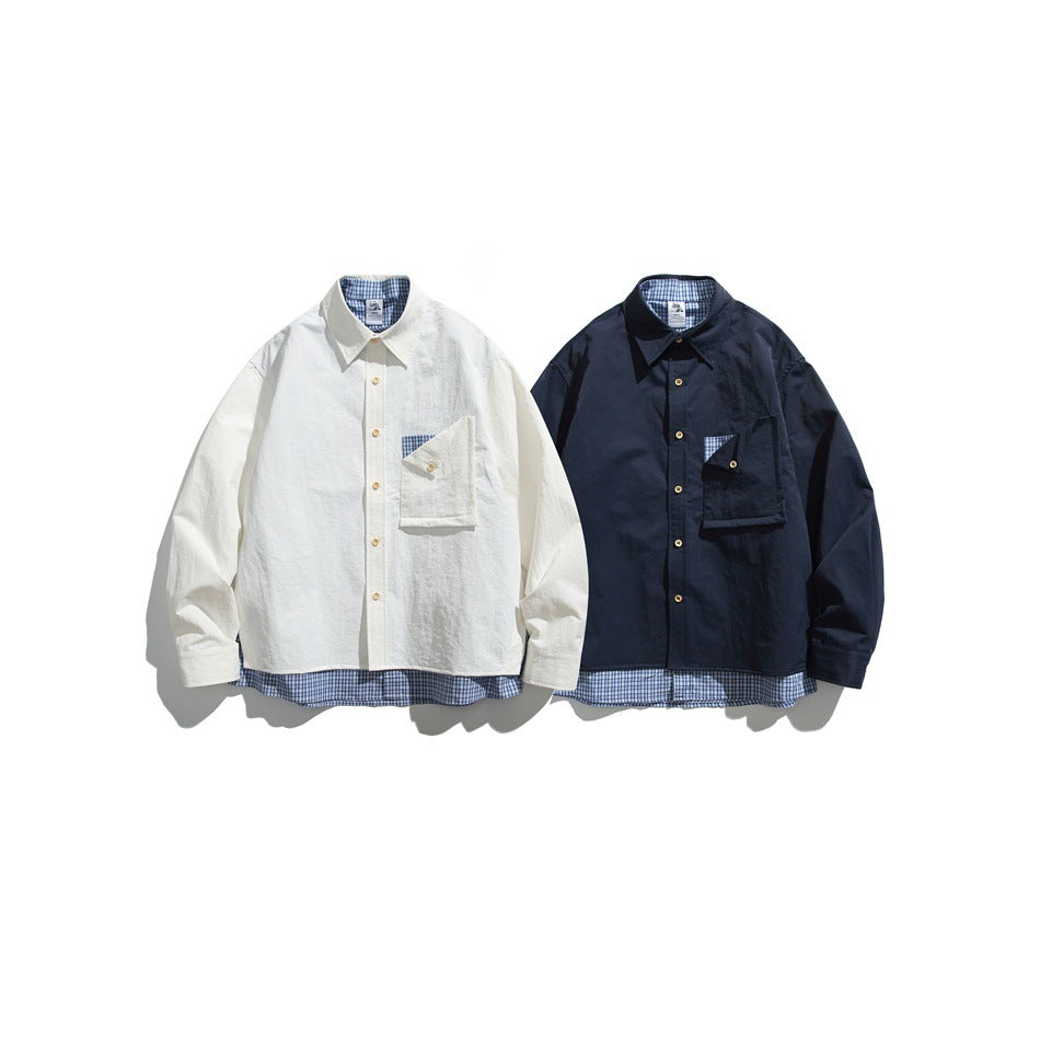 Two button-up shirts shown from the front, one off-white and one navy, with blue plaid lining and pocket accents.