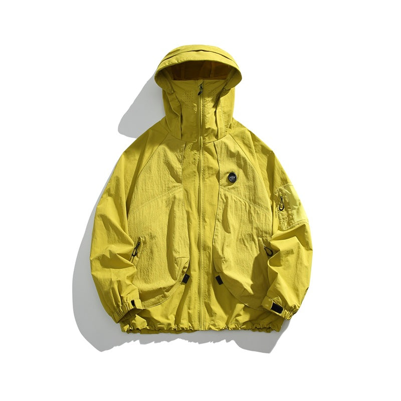 Mustard yellow hooded zip-up jacket flat lay with sleeve pocket and cuff tabs