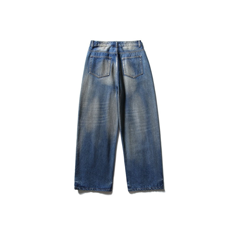 Back view of wide-leg blue faded jeans with two rear patch pockets.