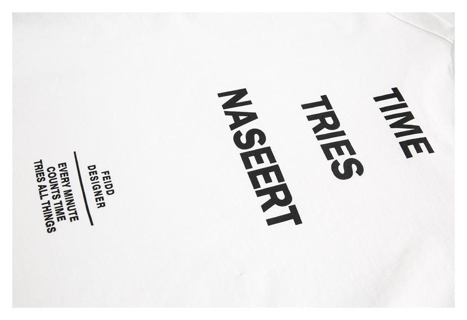 White garment close-up showing black printed TIME, TRIES, NASERT, and smaller text.