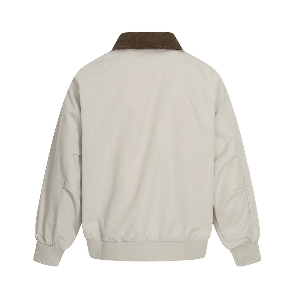 Back view of a light beige jacket with a contrasting brown collar, ribbed cuffs, and ribbed hem.