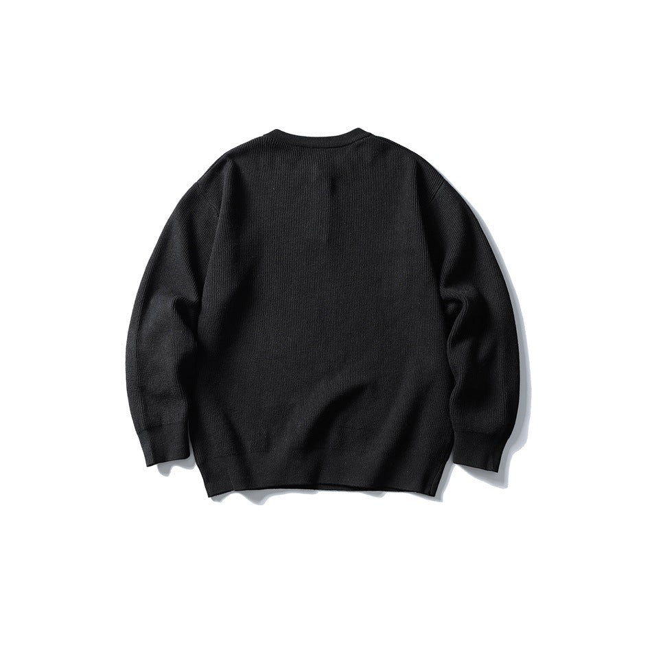 Back view of black ribbed-knit sweater with round neckline, flat lay