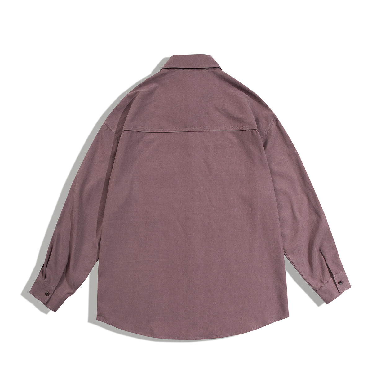 Back view of a dusty mauve long-sleeve shirt with a pointed collar, buttoned cuffs and a horizontal shoulder yoke.