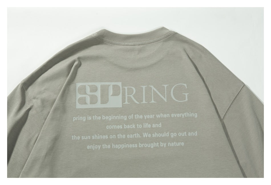 Close-up of the shirt's back, showing the white SPRING graphic and smaller printed text.