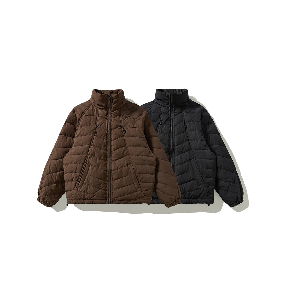Two quilted zip-front jackets shown from the front, one brown and one black.
