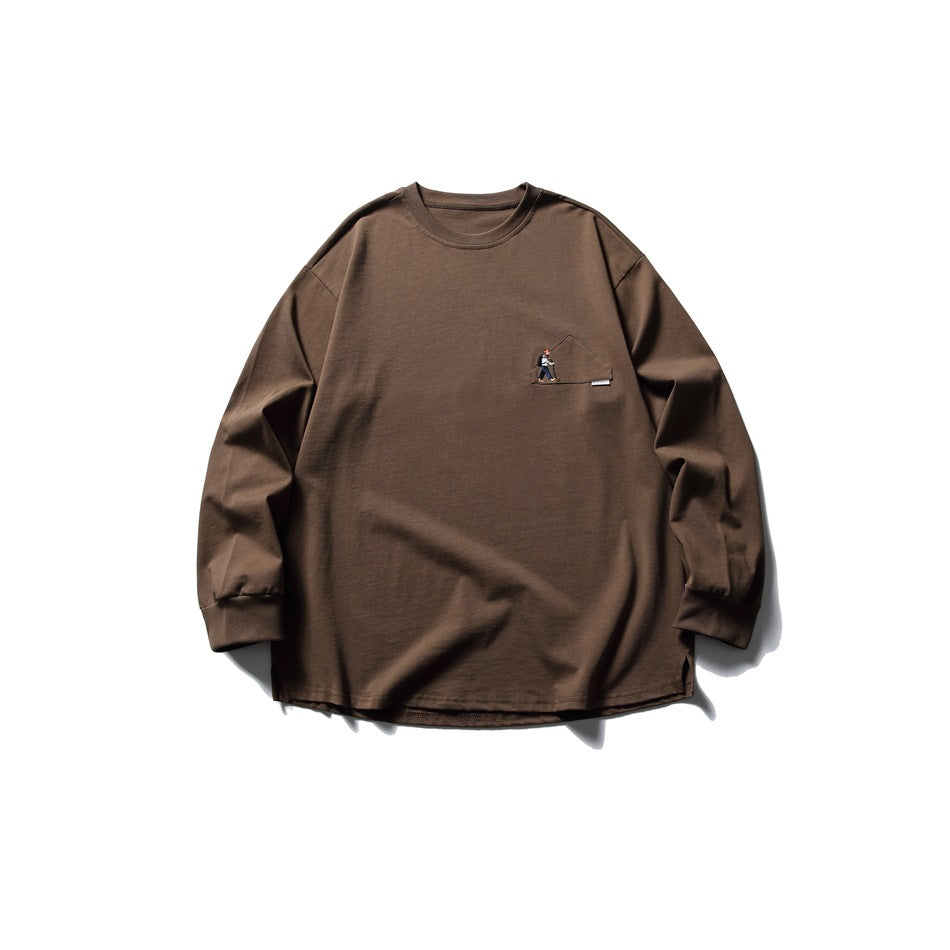 Brown long-sleeve crew neck tee flat lay with a small embroidered hiker motif on the chest