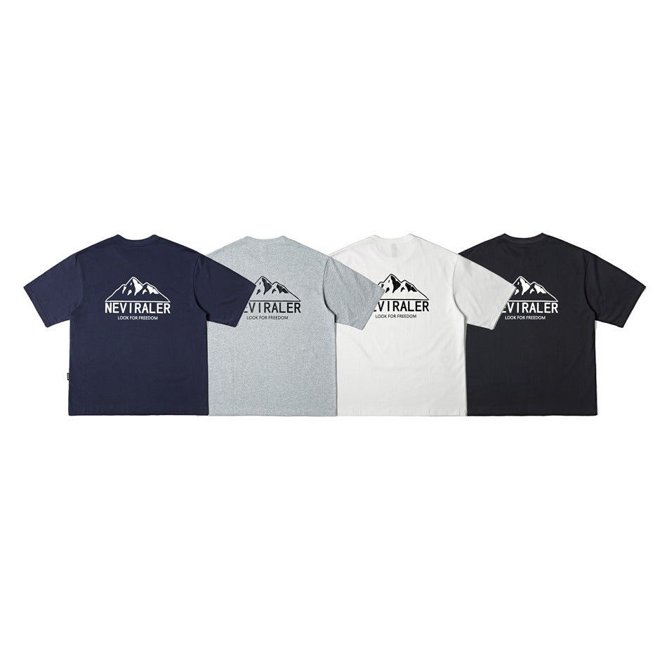 Rear view of four short-sleeve T-shirts in navy, heather gray, white, and black, each with a mountain logo print.