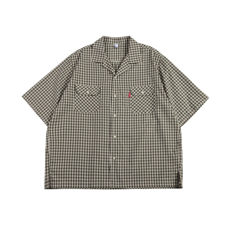 Green small-check short-sleeve camp collar shirt with two flap chest pockets, flat front view
