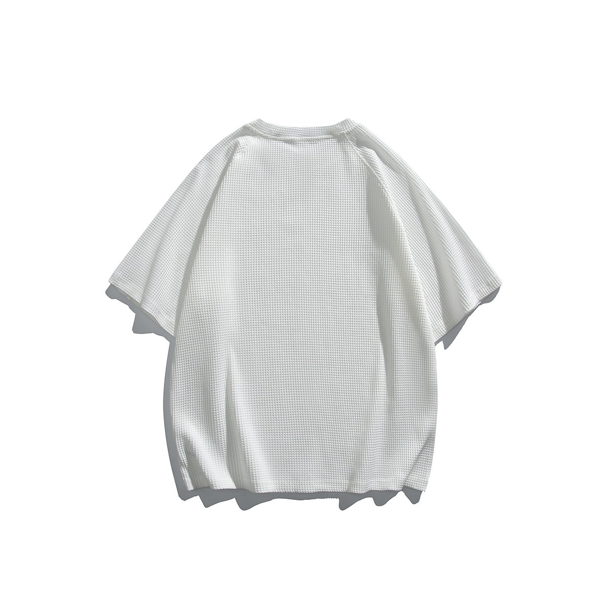 White short-sleeve waffle-textured shirt shown from the back, with raglan-style sleeves.