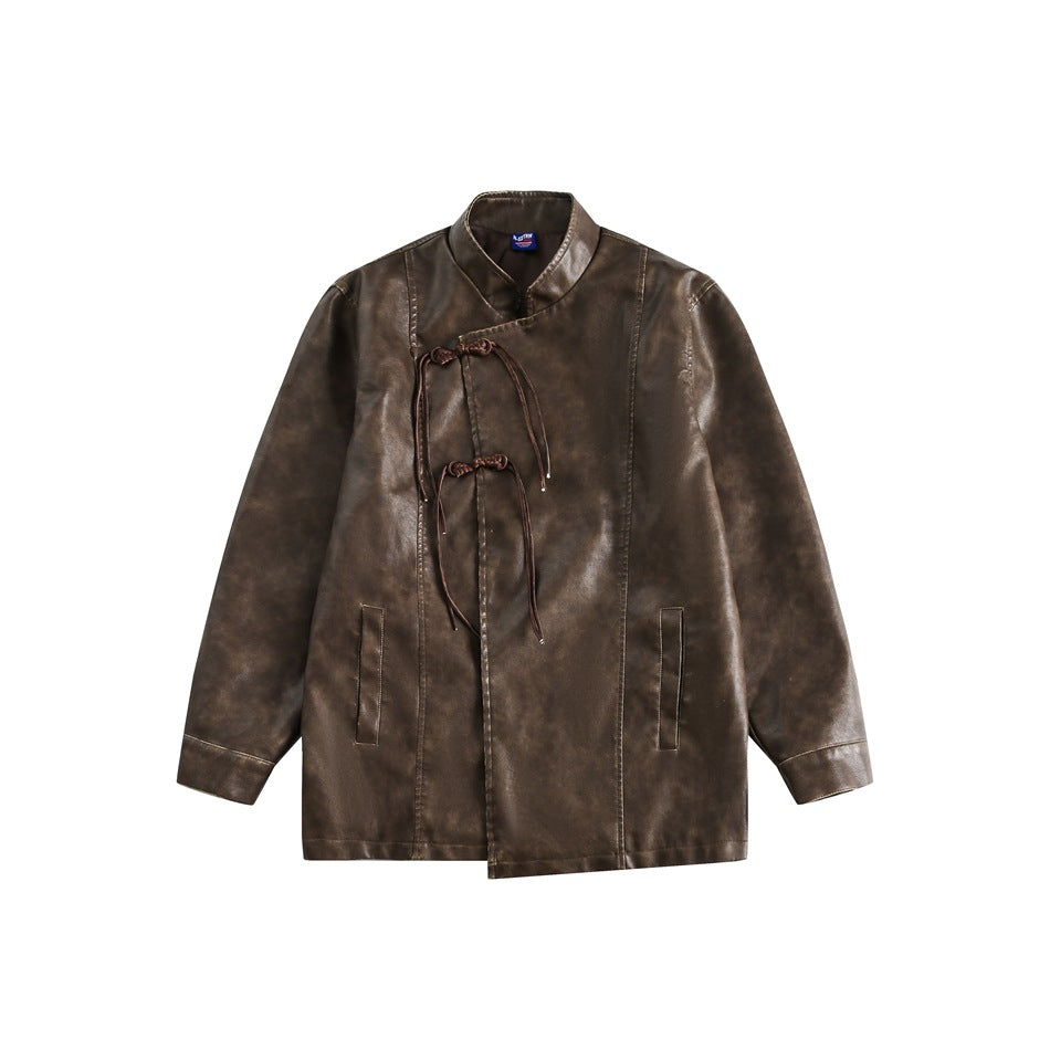 Front view of a brown mottled jacket with a stand collar, asymmetrical front, tie closures, and two pockets.