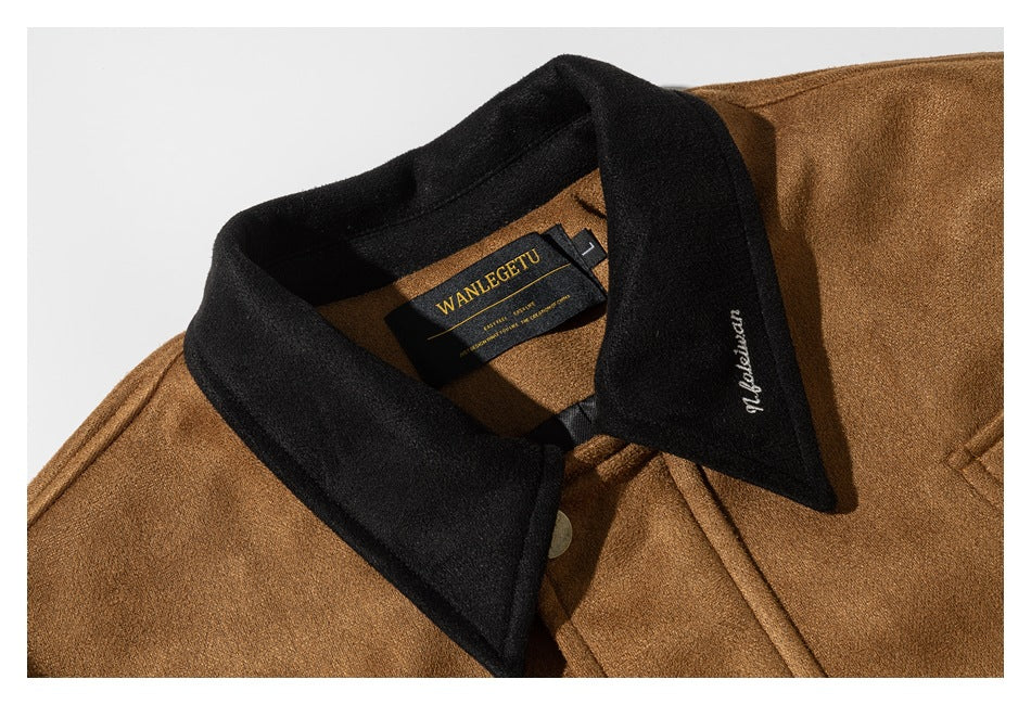 Close-up of a camel jacket with a black collar, front button, and neck label.