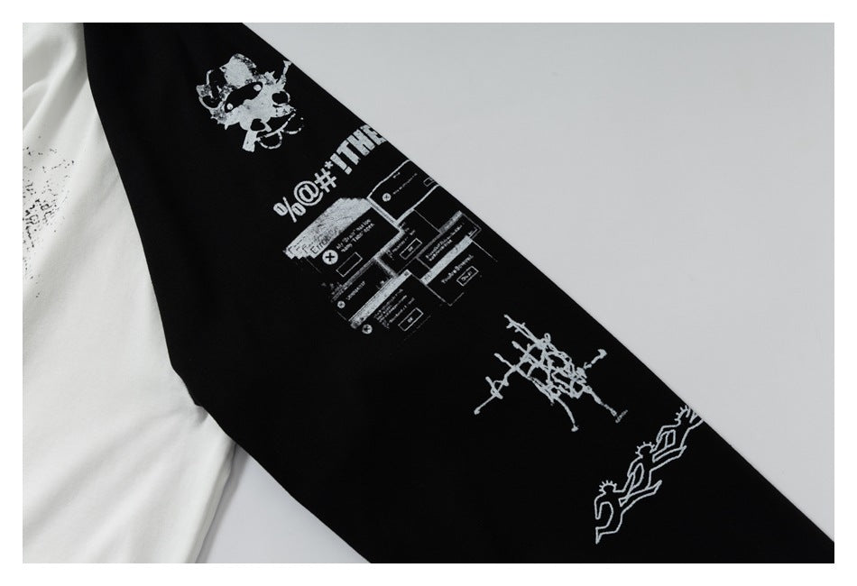 Close-up of a black sleeve with several white graphic prints and text.