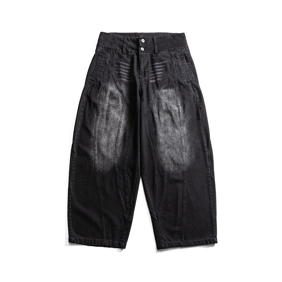 Black washed wide-leg jeans with faded thighs, double-button waistband and paneled seams, flat lay front view