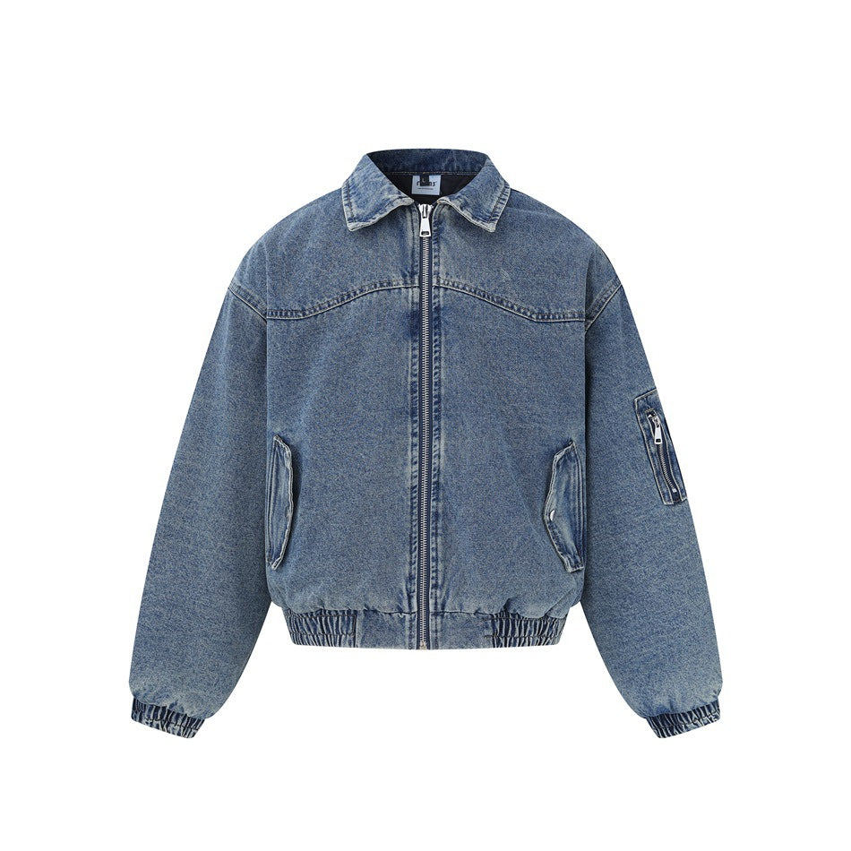 Blue washed denim bomber-style jacket, front view, with collar, front zipper, slanted pockets and ribbed hem and cuffs