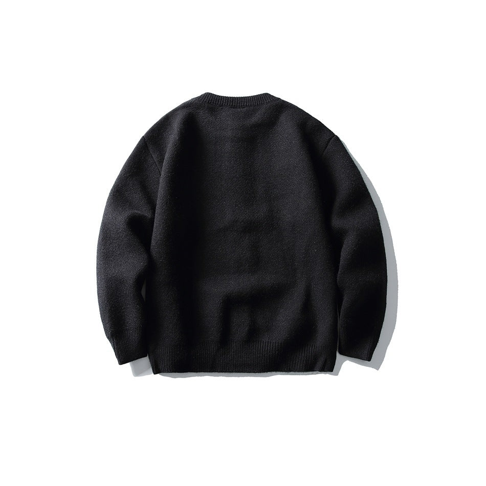 Black knit cardigan back view with ribbed crew neckline, cuffs and hem, flat lay