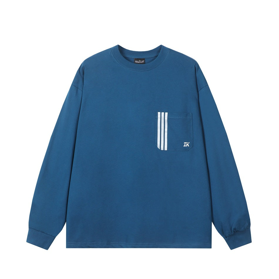 Blue long-sleeve crew-neck top with chest pocket and three vertical white stripes, flat front view