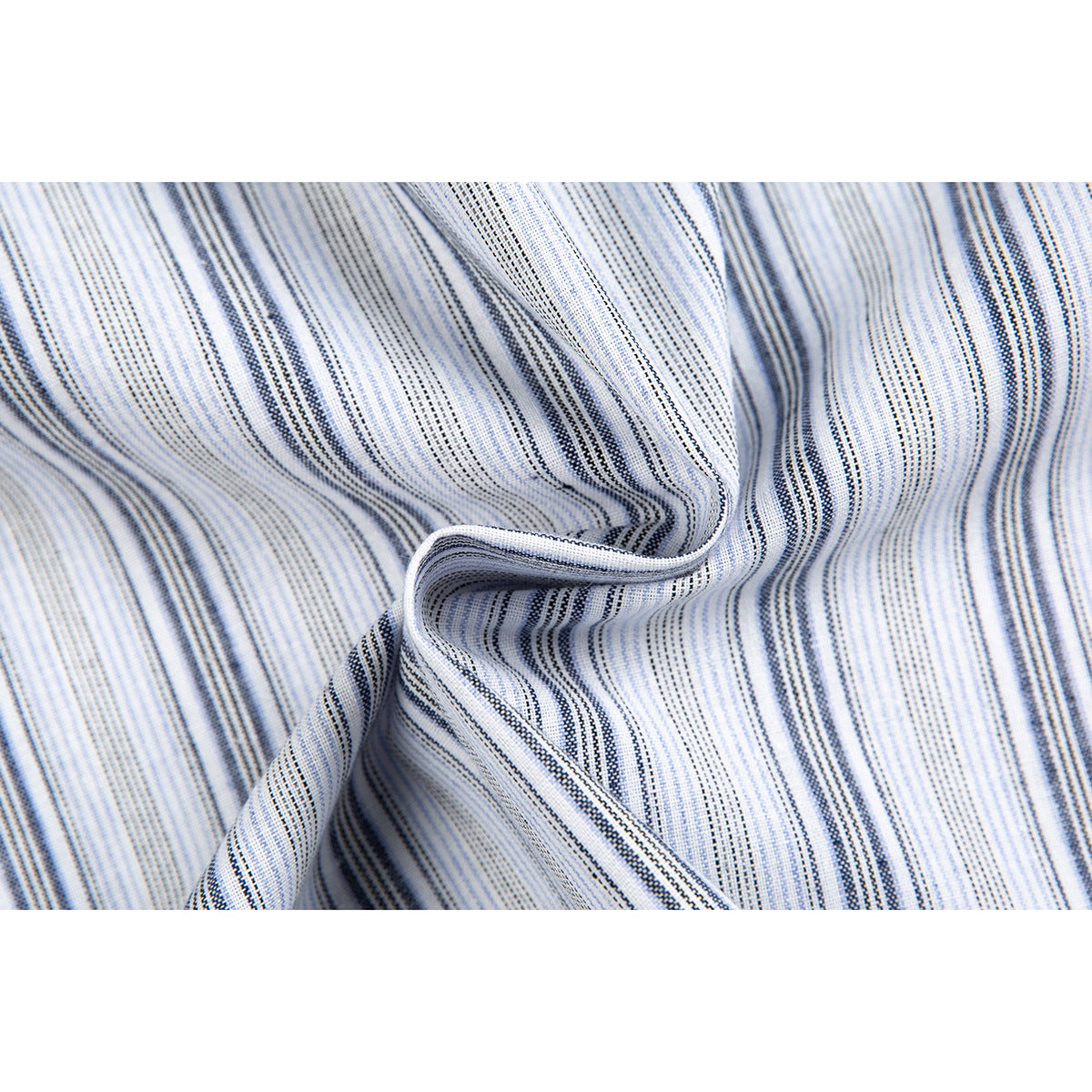 Macro view of white fabric with narrow blue-gray stripes folded into soft ripples.