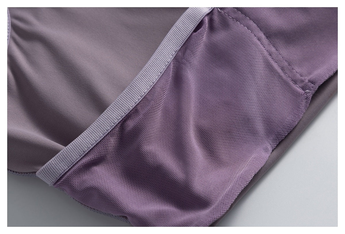 Close-up of a mauve mesh side panel and its ribbed seam binding.