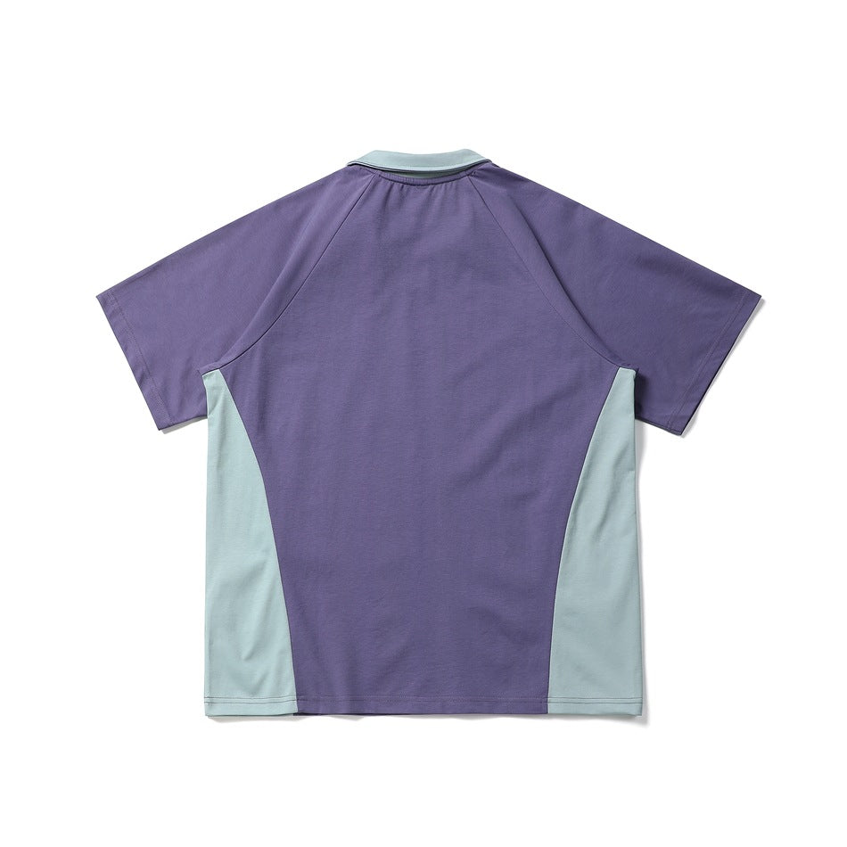 Back view of a short-sleeve color-block shirt, purple with pale blue-gray side panels and collar.