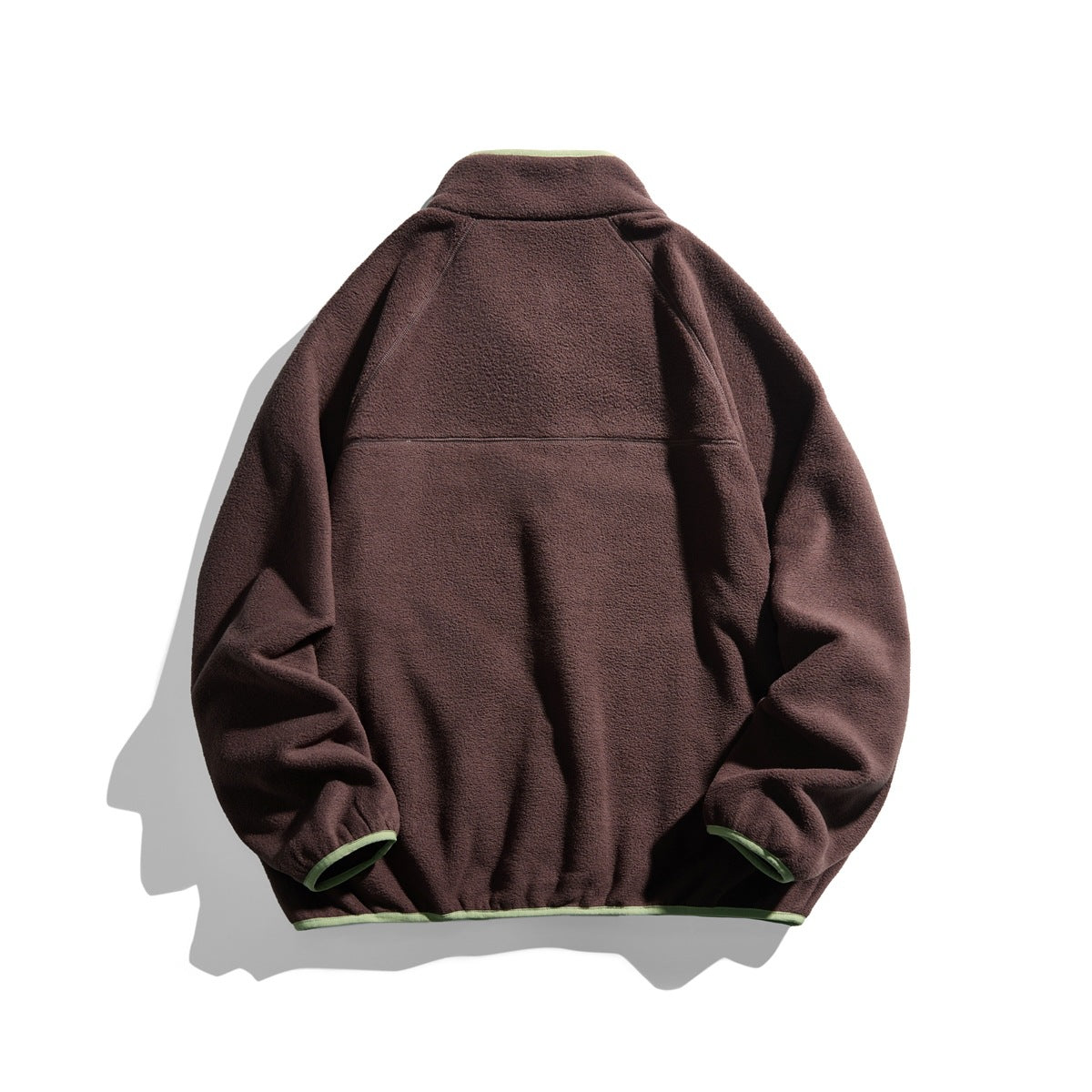 Back view of coffee brown fleece-textured jacket with light green trim at collar, cuffs and hem, and a yoke seam