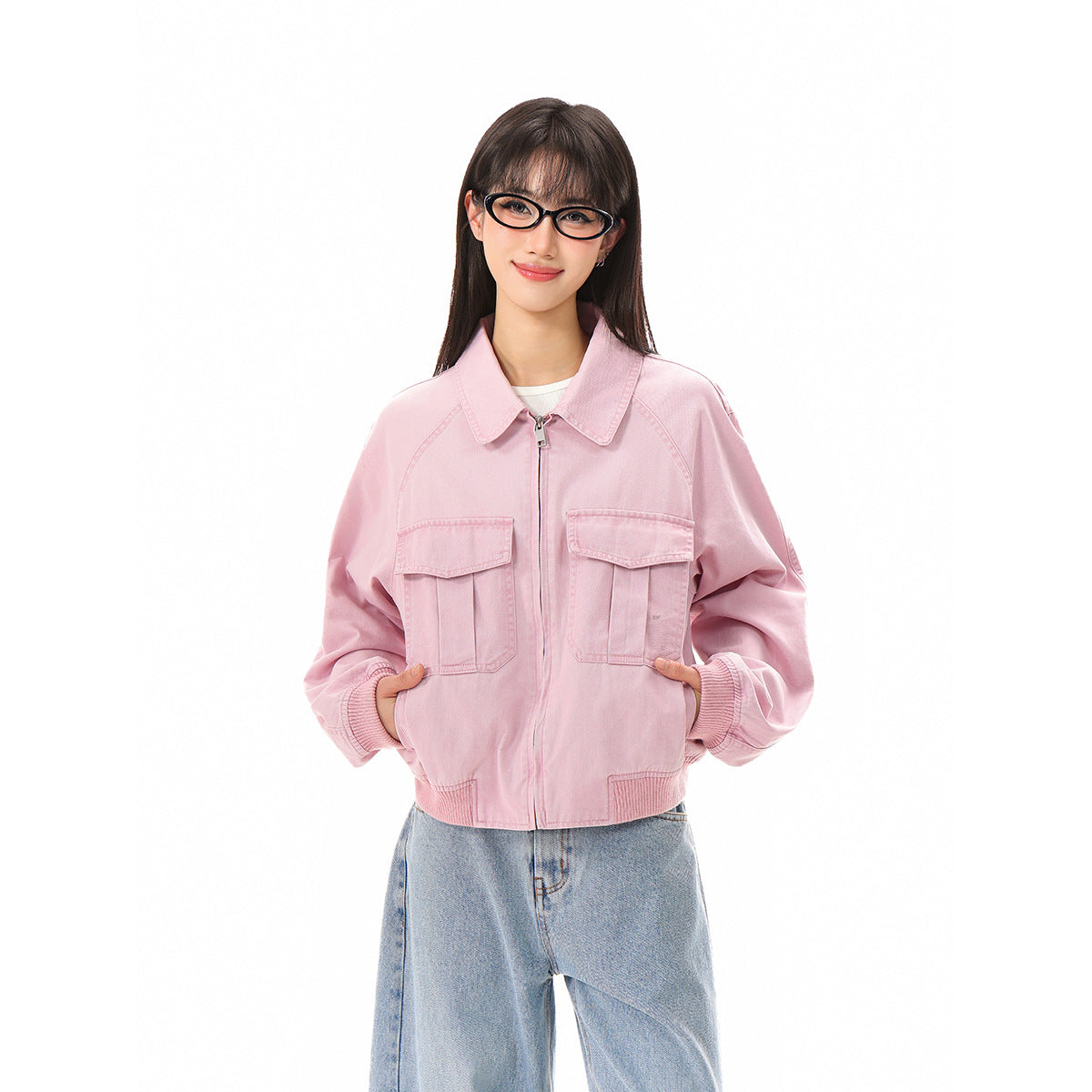 Model wearing a light pink zip-front jacket with a pointed collar, oversized sleeves, and two flap chest pockets.