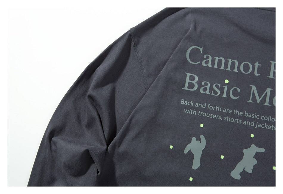 Close-up of a dark charcoal garment with partial English text and small graphic prints.