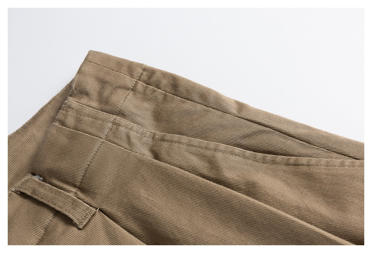 Close-up of the shorts' waistband, belt loop, and stitched seams.