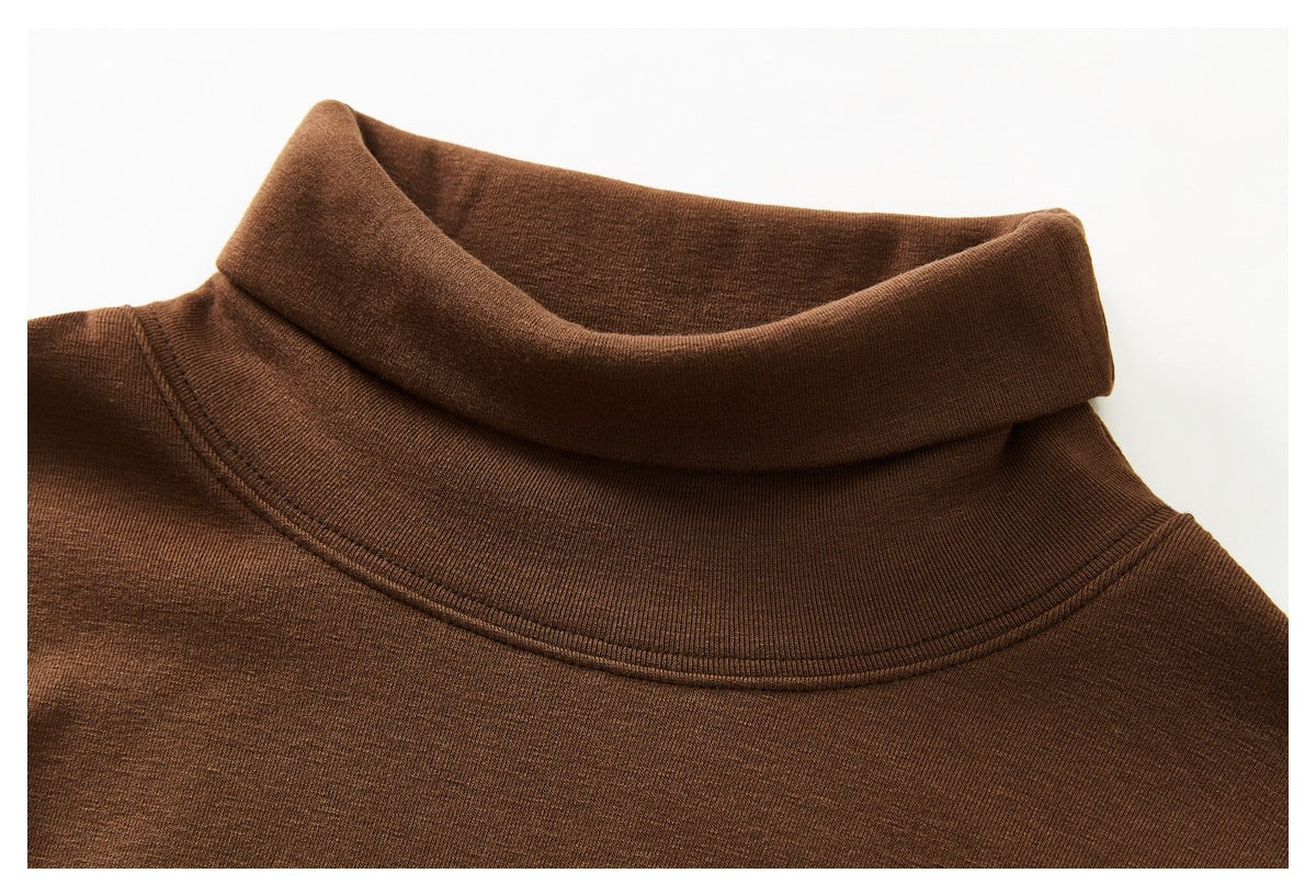 Close-up of the brown top's folded high collar and neckline stitching.