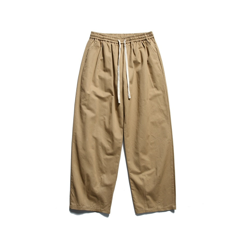 Khaki wide-leg drawstring pants with elastic waistband, flat lay front view