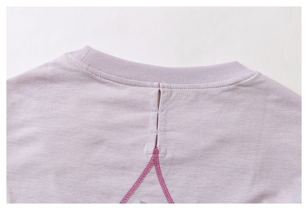 Back neckline of a pale lavender top with a ribbed collar, center slit, and pink seam detail.