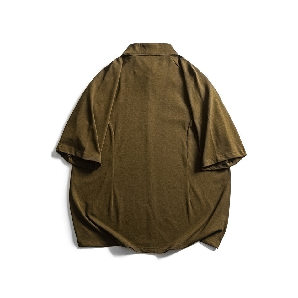 Back view of an olive-brown short-sleeve top with a stand collar and curved hem, laid flat.